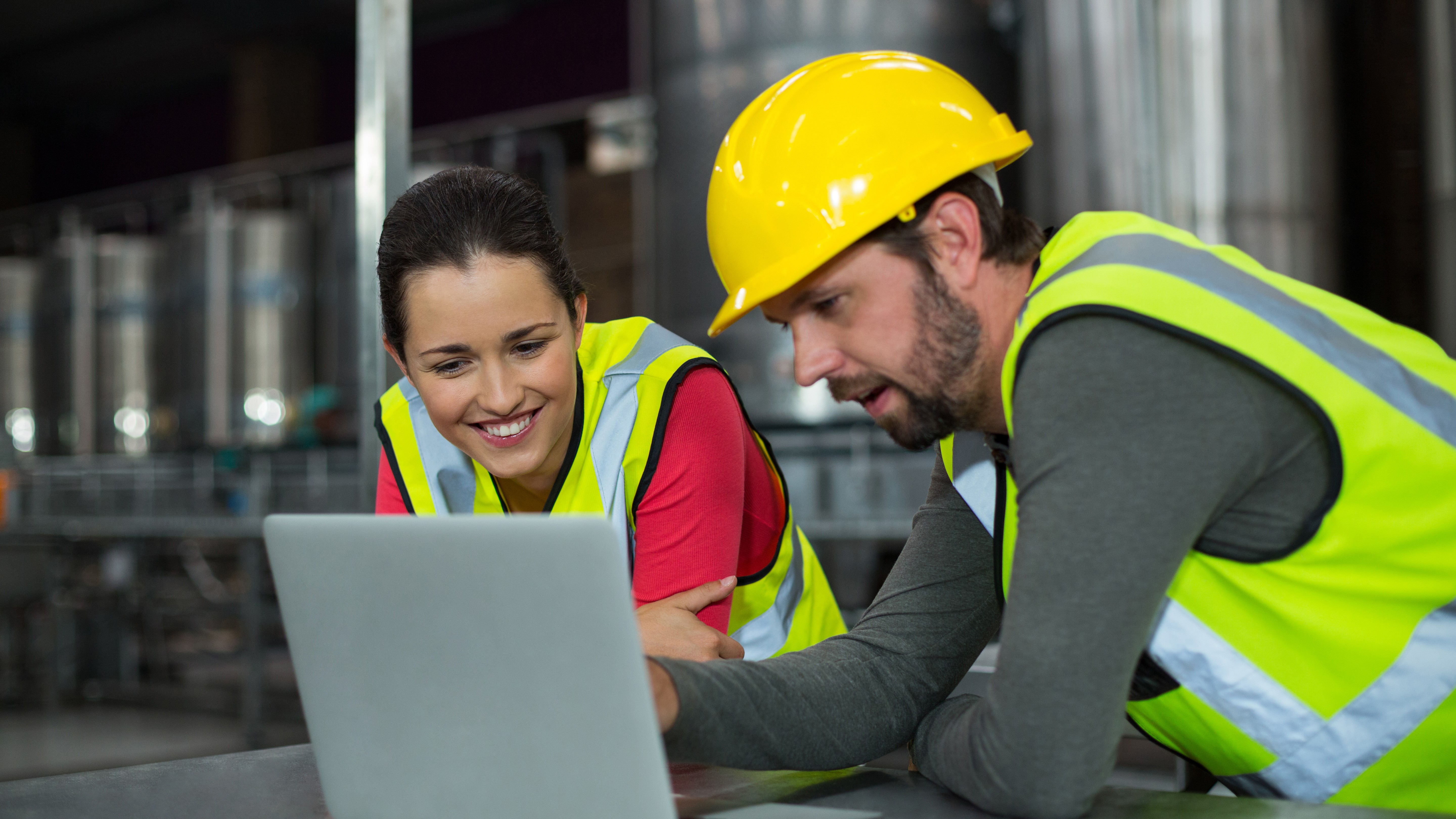 Factory workers using digital tablet